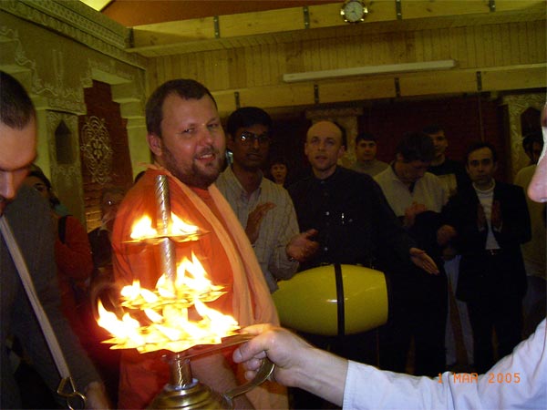 offering a sanctified fire to all the devotees and guests